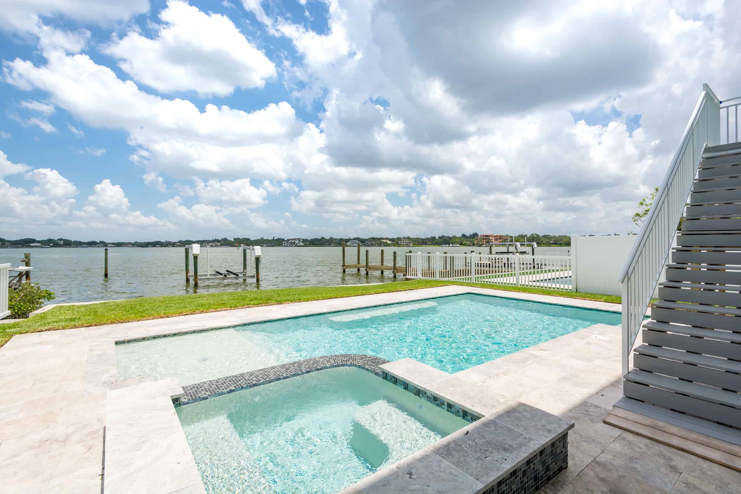Indian Rocks Beach custom home with pool deck and water view