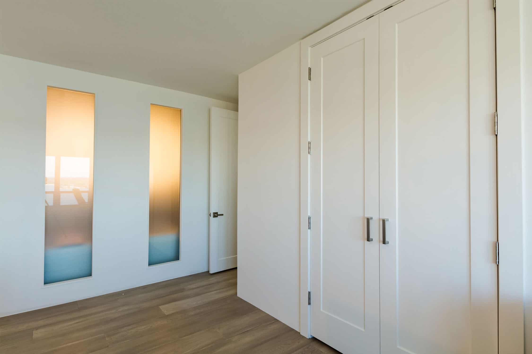 Backlit tub wall in St Petersburg condo bathroom remodel