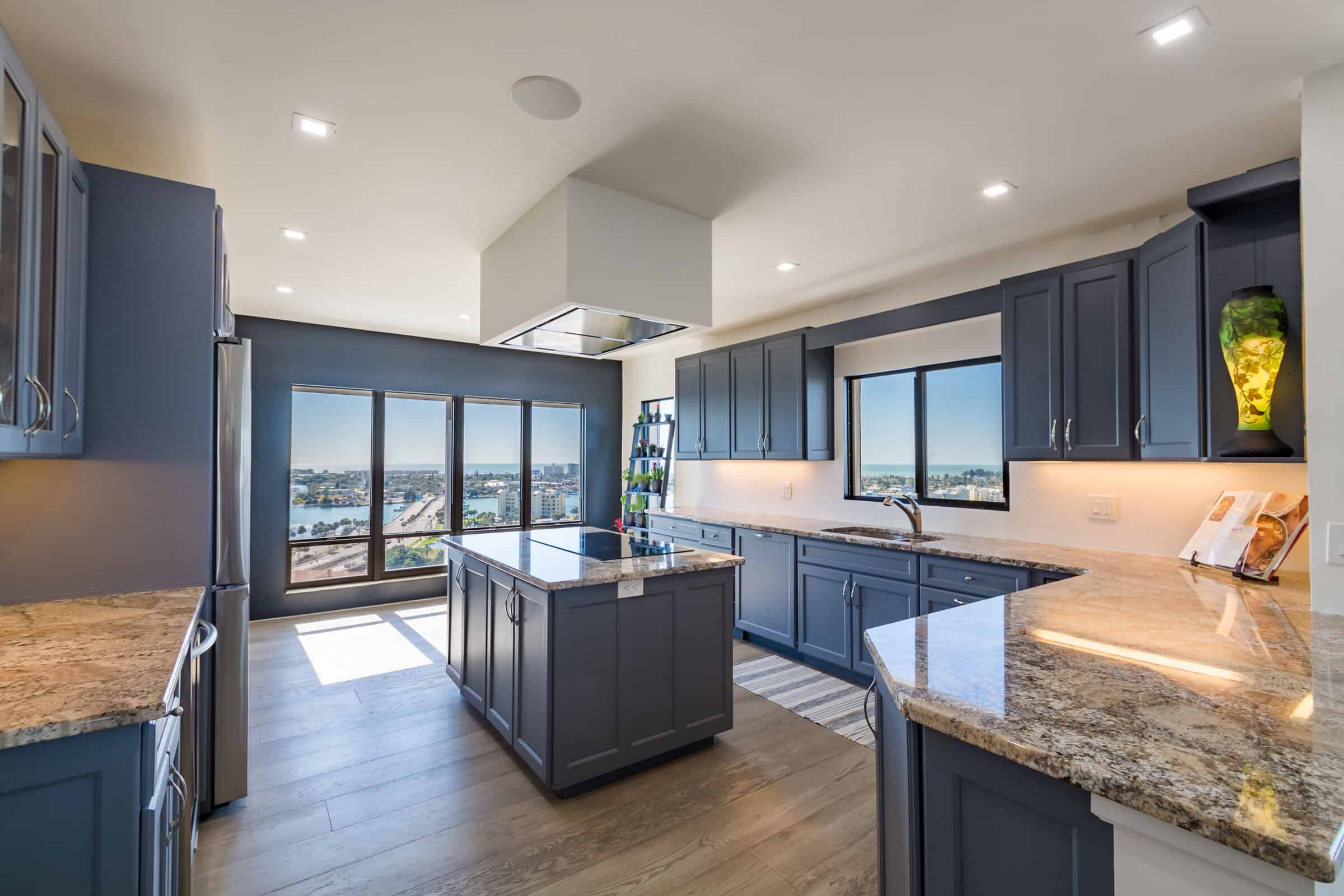 St Petersburg condo remodel kitchen with custom blue cabinetry and island
