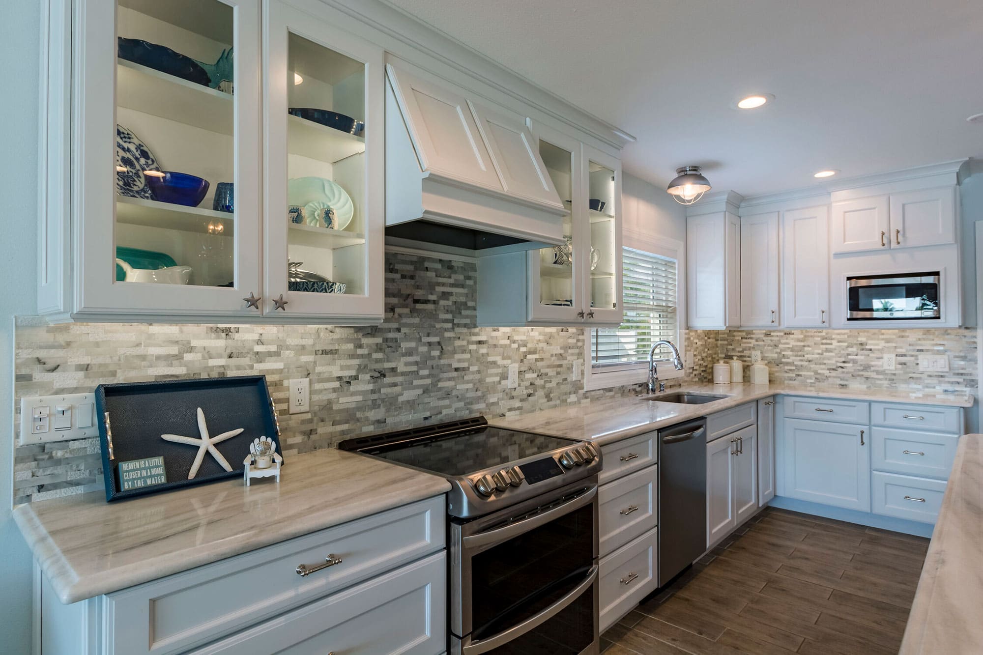 Glass cabinetry in St Petersburg kitchen remodel