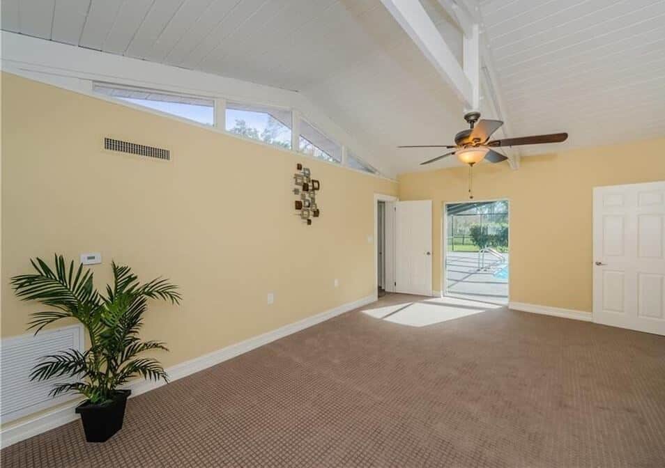 Bright Tampa living room remodel with preserved ceiling beams