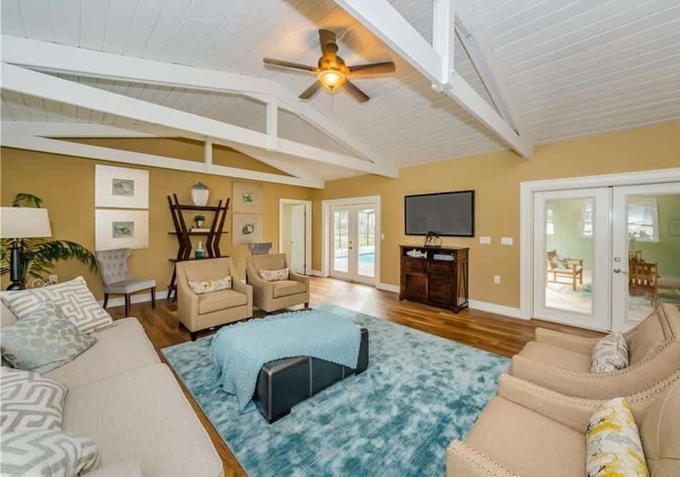 Tampa living room remodel with French doors opening to pool and backyard