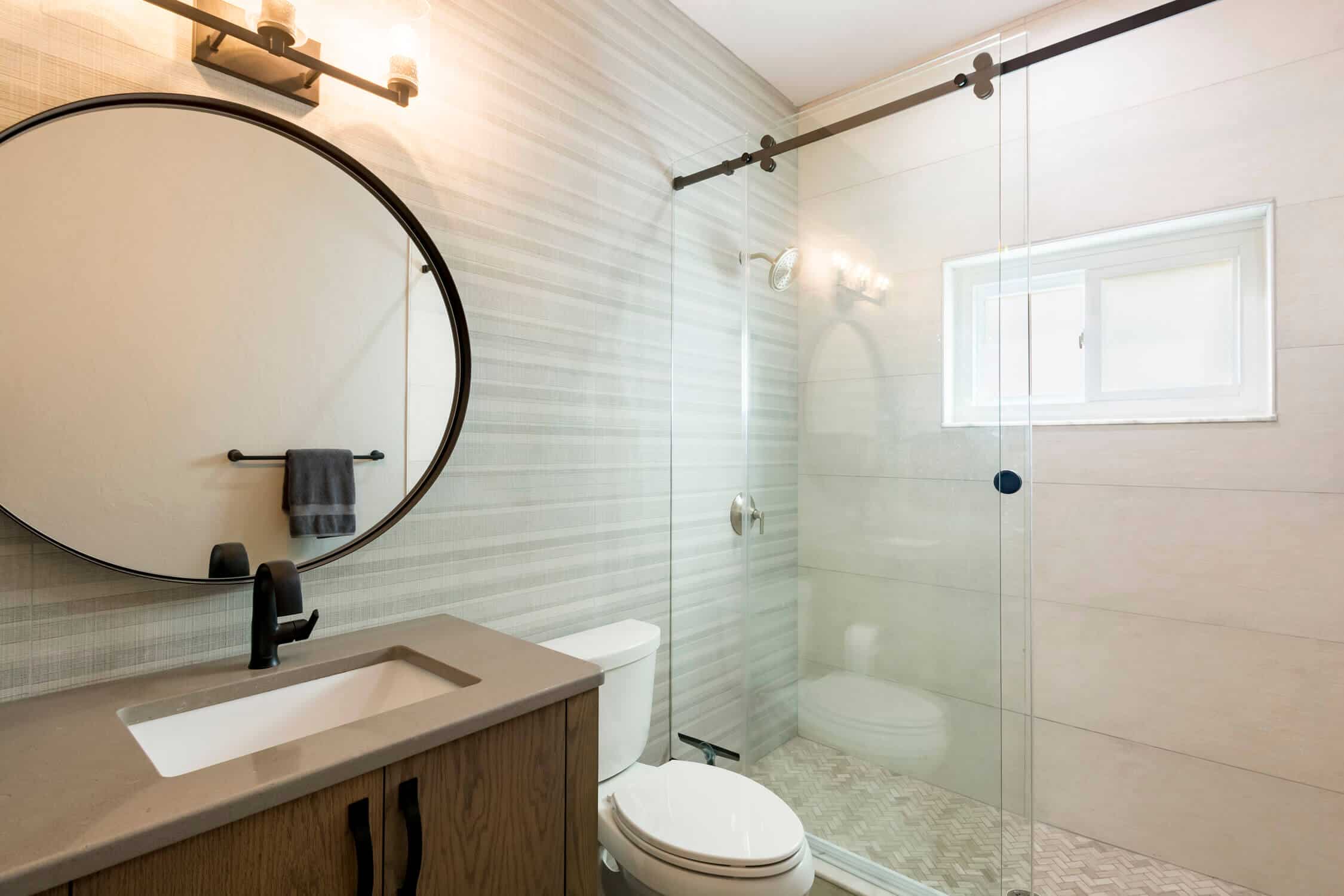 Condo bathroom featuring full wall tile