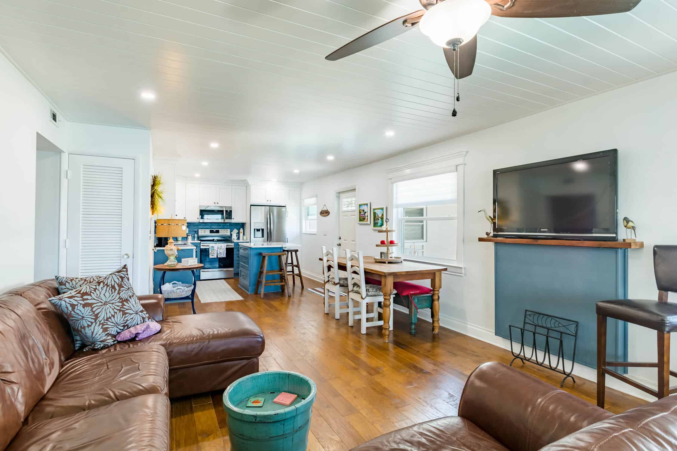 Kitchen remodel with tongue and groove ceiling and stained pine flooring