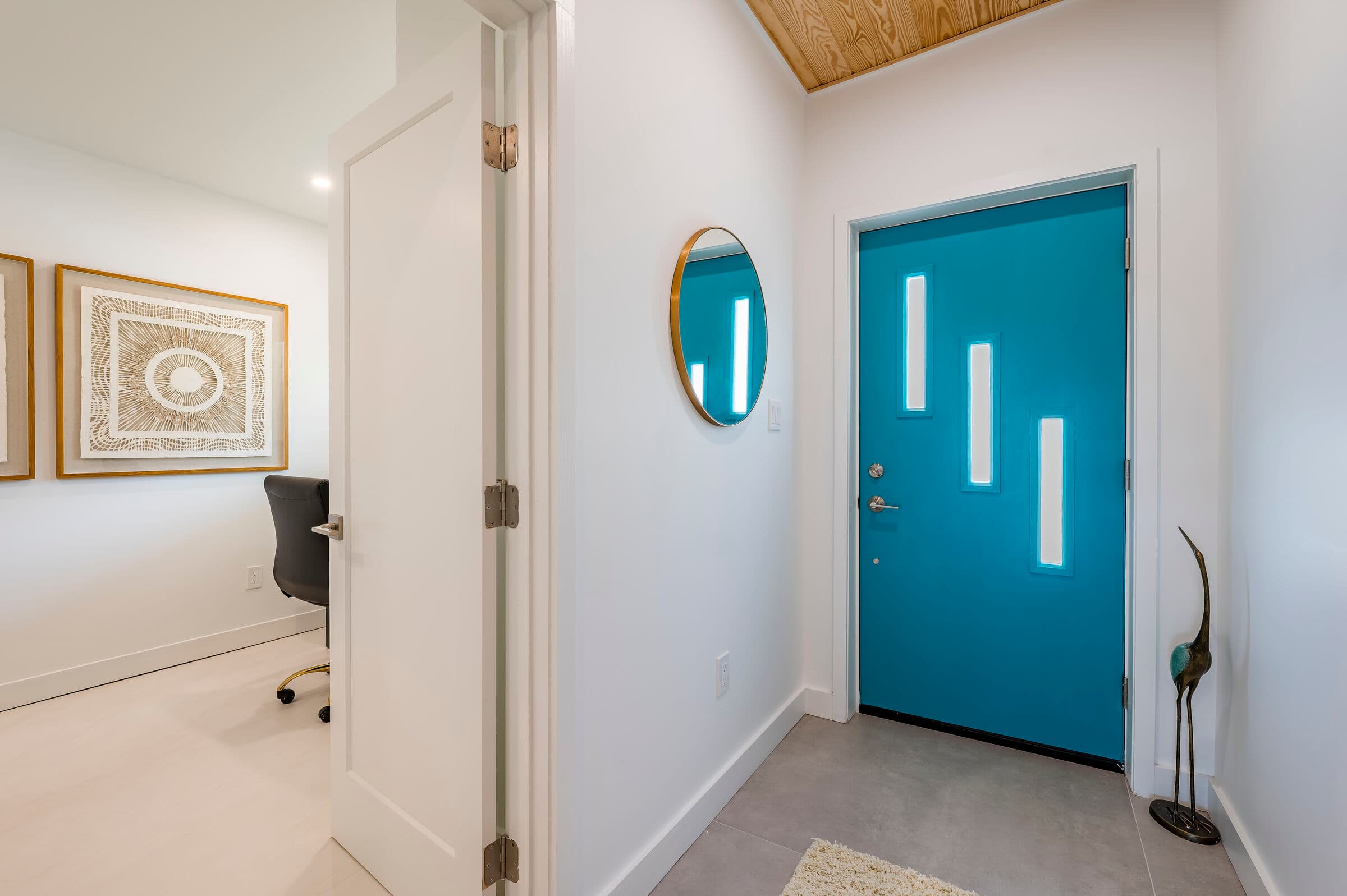 Interior entry hallway and adjacent room