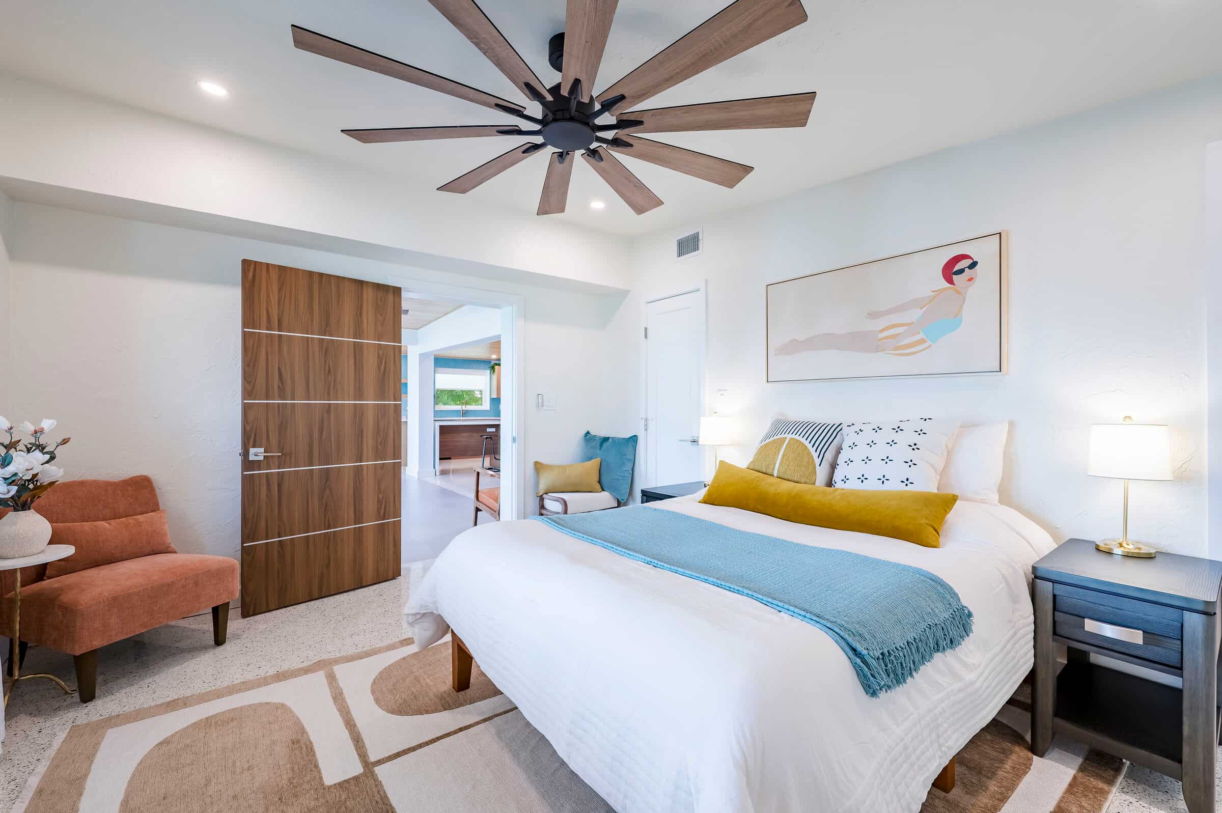 Bedroom with wood doors and ceiling fan