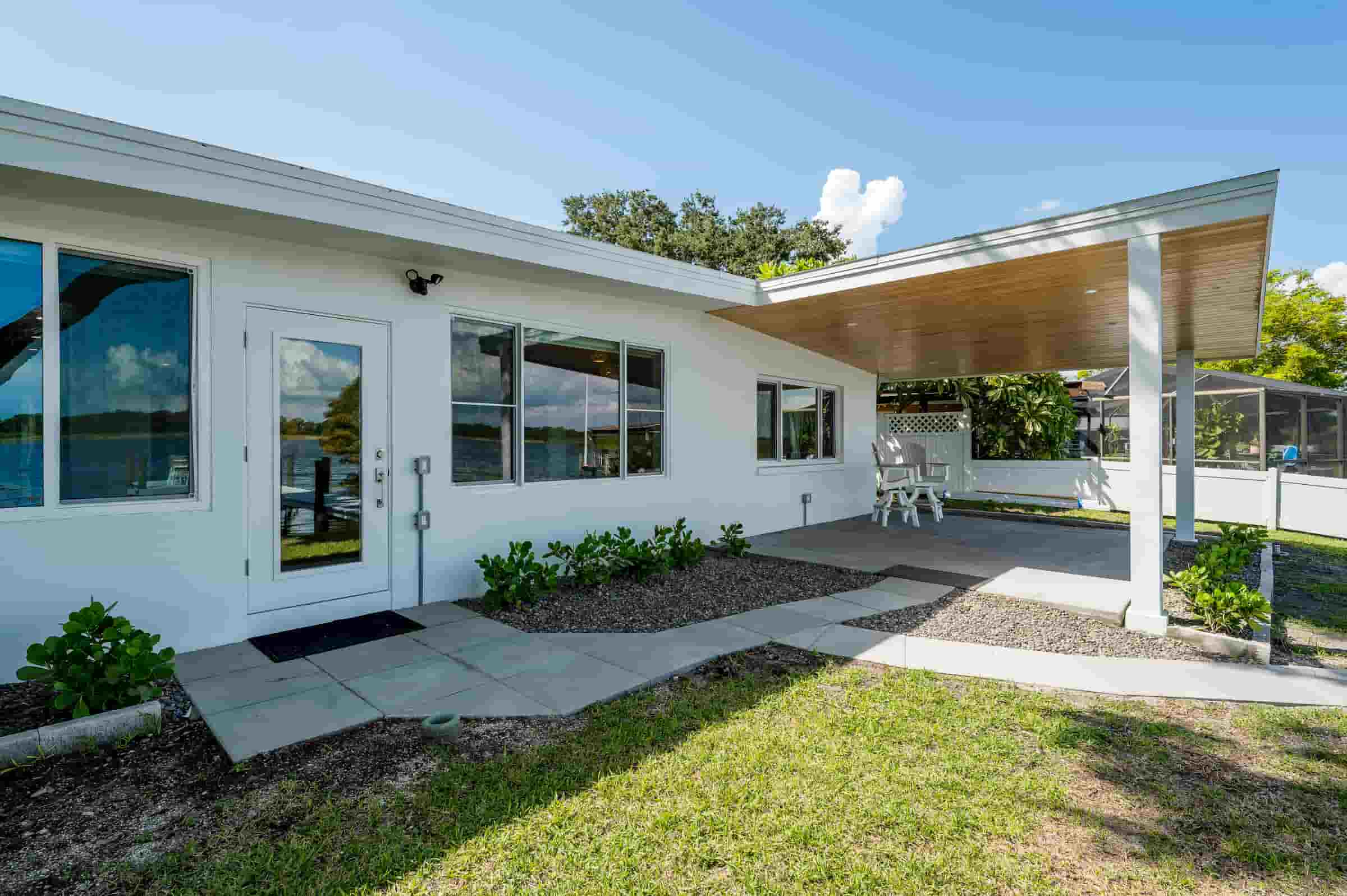 Rear exterior and patio of waterfront home