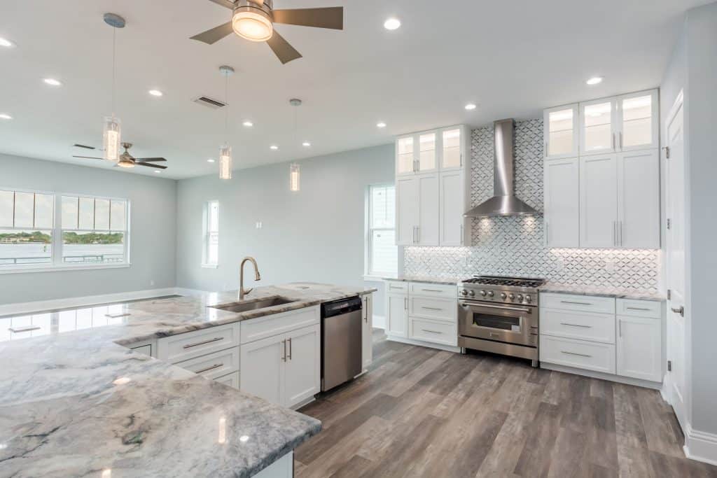 Home Builder in Indian Rocks Beach with kitchen backsplash and flush cabinets lit from inside